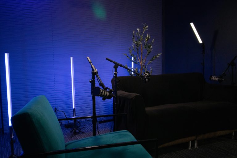Microphones and seating ready for a studio podcast